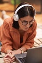 Modern Adult Woman Using Laptop on Floor Royalty Free Stock Photo