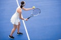Female Tennis Player Serving Ball Royalty Free Stock Photo
