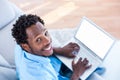 High angle portrait of man working on laptop