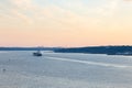 High angle selective focus view of cargo ship on the St. Lawrence River at sunset Royalty Free Stock Photo