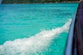 High angle of ship trail forming wave on surface of blue water of ocean. Abstract background of seawater, deep blue ocean wave Royalty Free Stock Photo