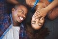 Looking forward to hearing her laugh everyday. High angle shot of an attractive young couple laying on the floor in