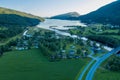 High angle shot of a beautiful landscape with green mountains, village and river somewhere in Norway Royalty Free Stock Photo