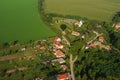 High angle shot of the beautiful Nove Sady village with colorful roofs and green fields