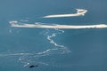 High angle shot of a beautiful river with sparkling shiny water surface and rescue chopper flying across in search operation