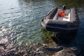 High angle shot of a black inflatable raft on the water in Cadaques