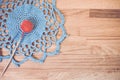 High angle shot of blue handmade crochet on a wooden surface Royalty Free Stock Photo