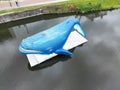 High-angle shot of a blue whale statue on a part of the Dender River in Dendermonde, Belgium