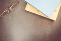 High angle shot of books and objects on a dark surface - education and culture concept