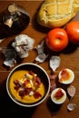 High-angle shot of a bowl with spanish salmorejo, a typical cold soup made with tomato, bread, olive oil and garlic, topped with