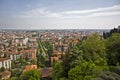 High angle shot of buildings near trees under a blue cloudy sky a daytime Royalty Free Stock Photo