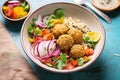 high angle shot of colorful falafel bowl with grains