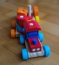 High angle shot of a colorful wooden toy train on a wooden surface Royalty Free Stock Photo