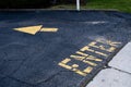 High angle shot of Enter text pained in yellow on the ground with a yellow arrow Royalty Free Stock Photo