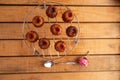 High angle shot of French pastry Caneles de Bordeaux on a wooden table