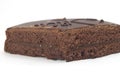 High angle shot of a fresh and delicious chocolate Sacher cake on a white surface