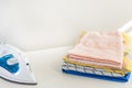 High angle shot of freshly ironed and folded towels on the table