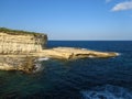 High angle shot of Globigerina Limestone cliff recession in St Peter\'s Pool, Delimara, Malta