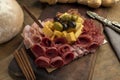 High angle shot of a gourmet delicious charcuterie board with different meats and cheeses