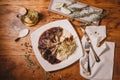 High angle shot of a gourmet kitchen table with juicy cooked meat