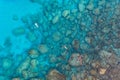 High angle shot of a group of people swimming in the Mediterranean sea