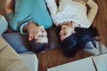 Our happy ever after starts today. High angle shot of a happy young couple lying on the floor. Royalty Free Stock Photo