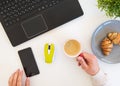 High angle shot of items on a table at an office workstation