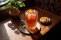 high-angle shot of lahpa on a wooden table with a glass of iced tea