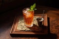 high-angle shot of lahpa on a wooden table with a glass of iced tea
