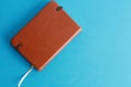High angle shot of a leather-covered book isolated on a blue background Royalty Free Stock Photo