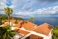 High angle shot of a local village on the cliff on Tenerife island by the ocean Royalty Free Stock Photo