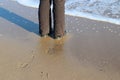 High angle shot of a male's shoeprint on the beach sand