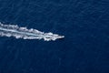 High angle shot of a motorboat sailing on the surface of the sea Royalty Free Stock Photo