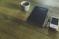 High angle shot of a notebook with a silver pen, a cup of coffee and white cellphone Royalty Free Stock Photo