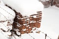 High angle shot of an old stone wall covered with snow and icicles Royalty Free Stock Photo