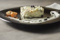 High angle shot of Olivie salad with cherry tomatoes on a dark plate Royalty Free Stock Photo