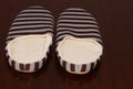 High angle shot of a pair of striped warm slippers