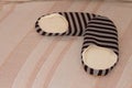 High angle shot of a pair of striped warm slippers