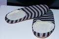 High angle shot of a pair of striped warm slippers