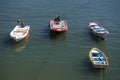 High angle shot of the parked small colorful boats in the sea