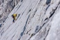 High angle shot of a person climbing a rock in the Alps in Austria - overcoming challenges concept