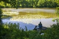 High angle shot of a person coarse fishing at a lake in Wiltshire, UK in the early morning