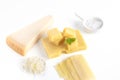 High angle shot of a piece of parmesan cheese and Swiss cheese isolated on a white background