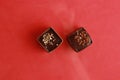 High angle shot of pieces of homemade chocolate isolated on a red surface