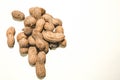 High angle shot of a pile of peanuts isolated on a white surface Royalty Free Stock Photo