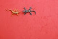 High angle shot of plastic lizard toy miniatures isolated on a color background with a copy space