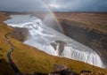 High angle shot of a rainbow over the Gullfoss waterfall in Iceland Royalty Free Stock Photo