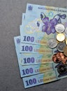 High angle shot of Romanian bills and coins on the table