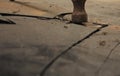 High angle shot of a rusted hammer destroying a rocky surface