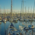 High angle shot of the sailing boats on the water by the port under the blue sky Royalty Free Stock Photo